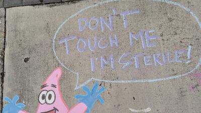 In one of Casey Drake's chalk drawings, Patrick Star from the cartoon TV series 'SpongeBob SquarePants' updates his wardrobe with a pair of medical gloves. Casey Drake