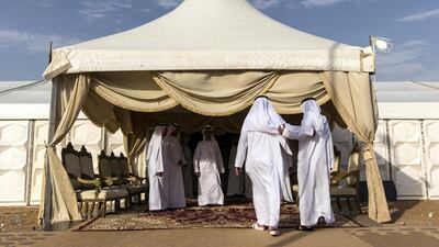 Men gather to pay their respects to the family of Captain Ahmed Khalifa Al Baloushi, 27, a UAE soldier who died in a helicopter crash while serving in Yemen, at a majalis outside the Al Towayya mosque in the Al Towayya area of Al Ain on August 13, 2017. Christopher Pike / The National