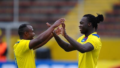 Ecuador's Felipe Caicedo (R) celebrates after scoring against El Salvador with teammate Cristian Benitez during a friendly football match at Olimpico Atahualpa stadium in Quito on March 21, 2013. Rodrigo Buendia / AFP