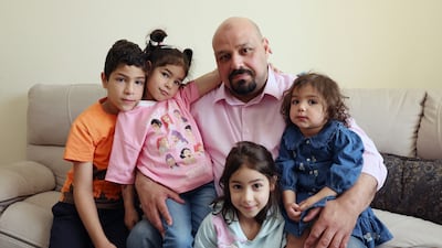 Eid Al Abasi with his children Suliman, 8, LuLu, 7, Lore, 5, and Noor at their family home in Al Ain. Chris Whiteoak / The National