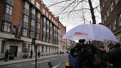 TV crews under a Sky News branded umberella. Sky is a major prize for rival media groups. AFP