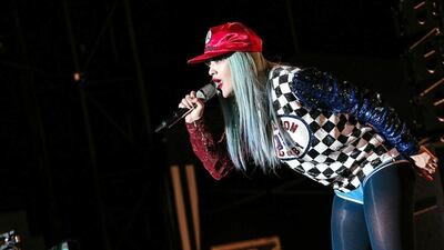 Rita Ora dressed the part. She is the kind of singer you want to party with. British pop star Rita Ora returned to the UAE with a big show featuring a band and backing dancers. With her almost-soprano voice on great form, Ora also looked the part on Grand Prix weekend with an onstage outfit consisting of a sparkling chequered flag and blue hair – or was it a very convincing wig? Courtesy Flash