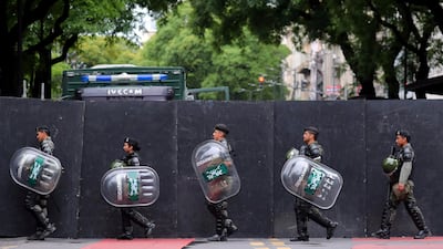 Members of Argentina's National Gendarmerie march outside a secured area in Buenos Aires, Argentina. Reuters