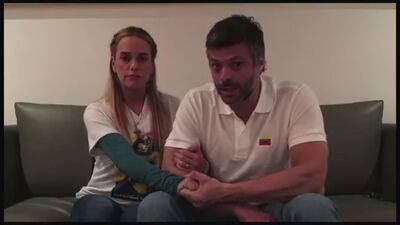 A still image taken from a video released on August 1, 2017 shows opposition leader Leopoldo Lopez and his wife, Lilian Tintori, talking in their house in Caracas, Venezuela on July 17, 2017. Reuters