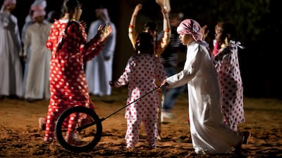 Children of employees and the foster families of Dar Zayed for Family Care, dancing and performing on Family Day. Silvia Razgova / The National