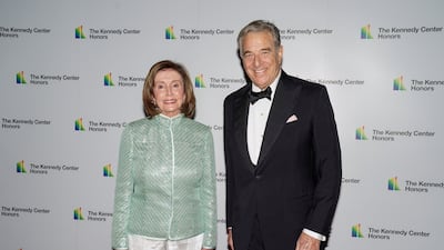 Speaker of the House Nancy Pelosi and her husband, Paul, in December 2021. Reuters