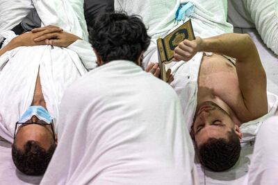 A Muslim worshipper reads from the Quran at the Grand Mosque in Makkah. AFP