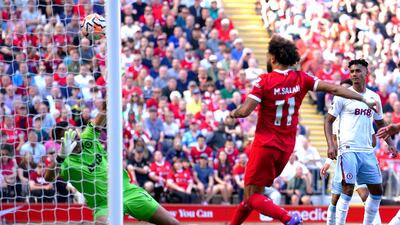 Mohamed Salah scores Liverpool's third goal. PA