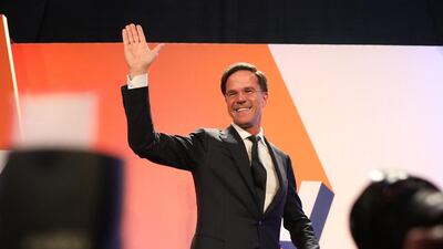 Mark Rutte, Dutch prime minister and leader of the Liberal Party (VVD), waves to supporters in The Hague, Netherlands, on Wednesday. Mr Rutte’s Liberals easily beat off an election challenge by the anti-Islam Freedom Party of Geert Wilders. Chris Ratcliffe / Bloomberg
