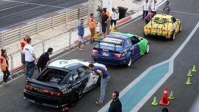 Drivers participating in the Drift Allstars line up their cars before hitting the track.