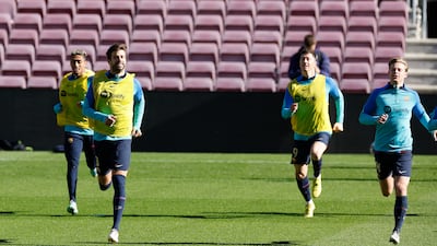 Barcelona's Gerard Pique with Robert Lewandowski, Raphinha and Frenkie de Jong during training. Reuters