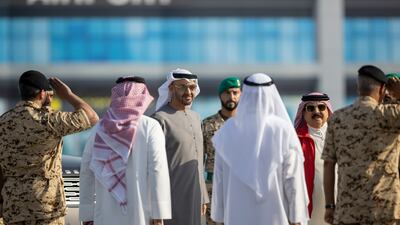 Sheikh Mohamed and King Hamad greet members of the Bahraini Armed Forces.
