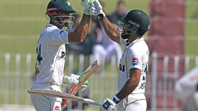 Pakistan's captain Shan Masood, left, and Abdullah Shafique celebrate after winning the third Test. AFP