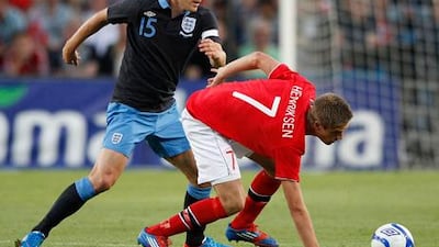 Gareth Barry challenges Markus Henriksen