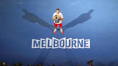 Stanislas Wawrinka of Switzerland poses with his trophy after winning the men's final match against Rafael Nadal of Spain at the Australian Open in Melbourne in January this year. Mast Irham / EPA