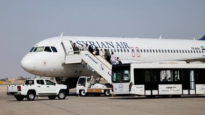 Passengers boarding at Damascus International Airport. The Airbus deal is aimed at enhancing the fleet and increasing the competitiveness of Syria's national carrier. Reuters