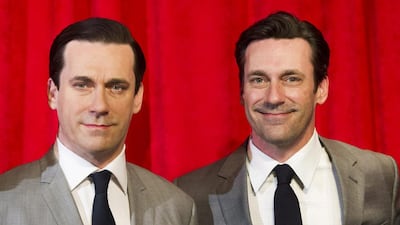 Jon Hamm, right, poses with his wax likeness at an unveiling at Madame Tussauds on Friday, May 9, 2014 in New York. AP