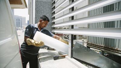 One of the steps taken to keep the cooling towers cool is to drop nine tonnes of ice a day into them. Rebecca Rees for The National