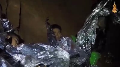 A video grab handout made available by Thai Royal Navy shows some of the members of the trapped football team. Royal Thai Navy / EPA