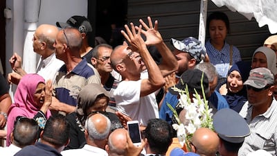 A man mourns Anis El Werghi during his funeral in Tunis on July 9, 2018. The Tunisian security forces member was killed in an ambush near the border with Algeria earlier in the week . Reuters