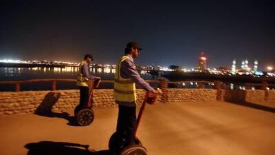 Abdul Rasul al Belooshi and Omar al Belooshi, cousins, patrol in RAK on Segways.