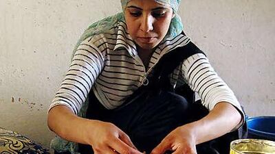 Najat Bouloudn, 20, shells out the kernels of dried argan fruit, which produce oil prized for its nutty taste and health benefits.