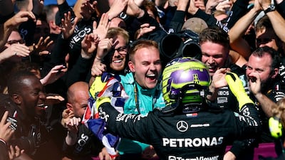Lewis Hamilton celebrates with the Mercedes team after winning the British Grand Prix. Reuters
