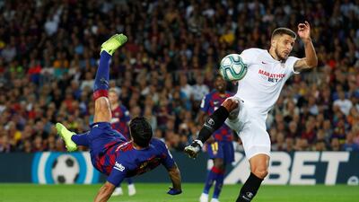 Barcelona's Luis Suarez scores a spectacular overhead kick against Sevilla in La Liga on Sunday, October 6. Reuters