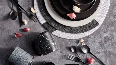 This monochrome 12-piece dinner set from Home Centre is for Dh179. Photo: Home Centre