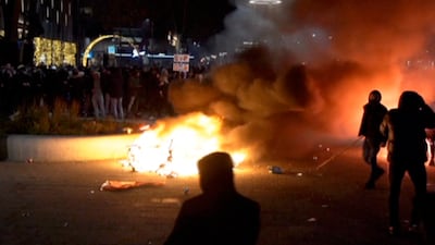 Police fired warning shots, injuring an unknown number of people, as riots broke out in central Rotterdam. Photo: Media TV Rotterdam via AP
