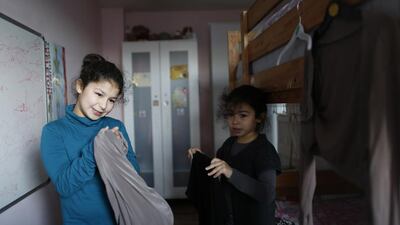 Sanaa, 10, and her sister Israa, 7, get ready for Islamic Saturday school in Leyton, east London. Sanaa wears the hijab on Saturday mornings when she attends an Islamic school and occasionally wears the hijab for school. Dalila, Sanaa’s mother, says ‘she may start to wear the headscarf every day next year. Sanaa will decide for herself when she’s ready to wear it.’