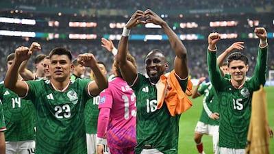 Mexico's Jesus Gallardo, left, Julian Quinones, centre, and Israel Reyes celebrate their World Cup Round of 32 win over Ecuador at the Mexico City Stadium. AFP