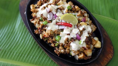Sizzling Sisig at Little Manila restaurant. Satish Kumar / The National