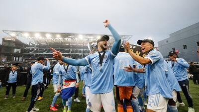 New York City defender Maxime Chanot and midfielder Tony Rocha celebrate with the MLS Cup. USA TODAY