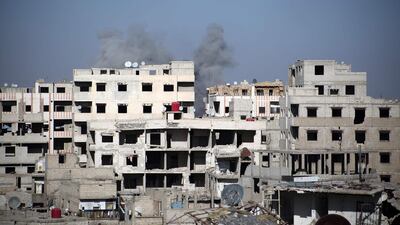 Smoke billows over Kafar Batna. Ammar Suleiman / AFP Photo