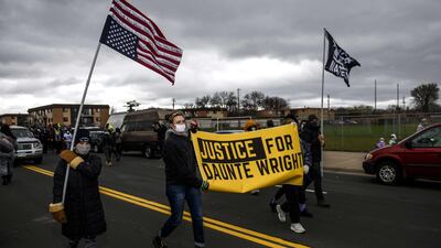 Protesters march from the Brooklyn Center police headquarters to a nearby FBI office. AFP