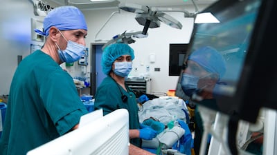 Doctors perform an endometriosis surgery at Corniche Hospital in Abu Dhabi. Victor Besa / The National