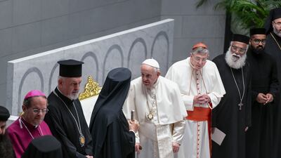 Pope Francis greets his fellow priests at the Cathedral of Our Lady of Arabia, Bahrain. Khushnum Bhandari / The National