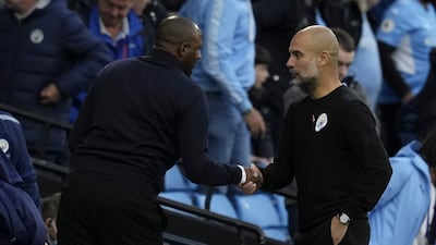 Patrick Vieira shakes hands with Manchester City manager Pep Guardiola. EPA