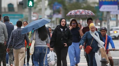 Rain pours at Hamdan Street in central Abu Dhabi. Victor Besa / The National