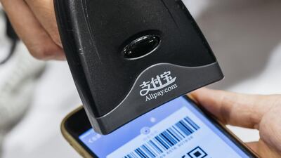 Mobile payment systems such as Alipay are one of the reasons cash use has fallen globally. Bloomberg