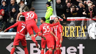 Monza's Patrick Ciurria, right, celebrates with teammates after scoring their opening goal. AFP