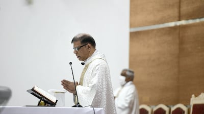 Father Cardoza delivers a sermon during the Christmas Eve midnight mass at St Paul's Catholic Church in Mussafah, Abu Dhabi. Khushnum Bhandari for The National