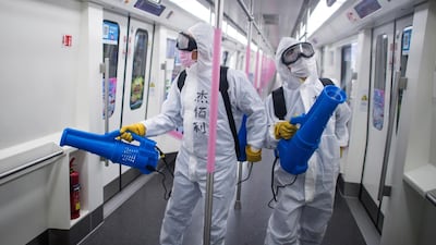 Workers disinfect a subway train in preparation for the restoration of public transport in Wuhan, in central China's Hubei province. AP