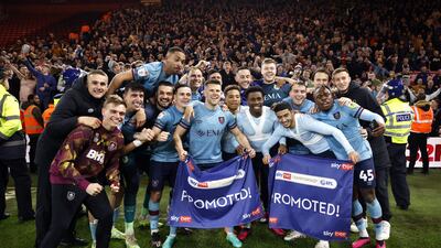 Burnley players celebrate promotion to the Premier League following the Sky Bet Championship match at the Riverside Stadium, Middlesbrough. PA
