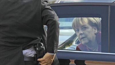 The German chancellor, Angela Merkel, steps out of her armoured car, at the European People’s Party summit in Belgium. Yves Logghe / AP Photo