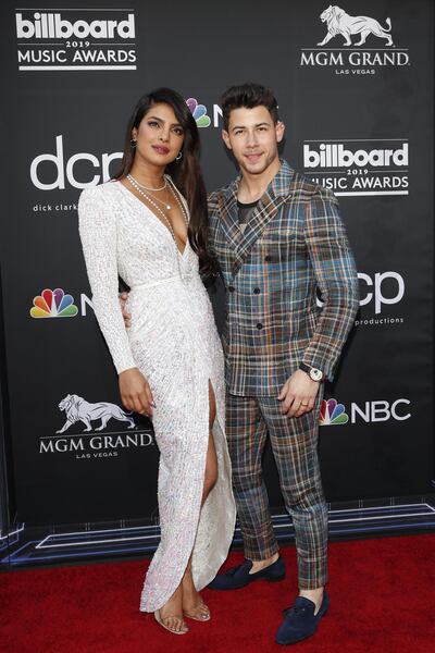 Priyanka Chopra in a Zuhair Murad dress with Yeezy heels, with husband Nick Jonas at the 2019 Billboard Music Awards on May 1. EPA