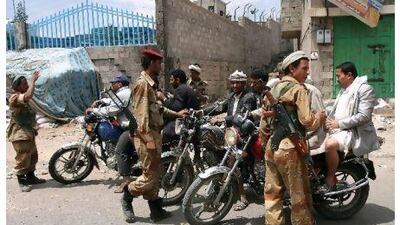 Yemeni soldiers who have defected to back anti-government protesters man a checkpoint near Change Square in Sanaa yesterday.