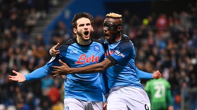 Khvicha Kvaratskhelia, left, celebrates with Victor Osimhen after scoring Napoli's first goal in their 2-0 Serie A win at Sassuolo on February 17, 2023. AP