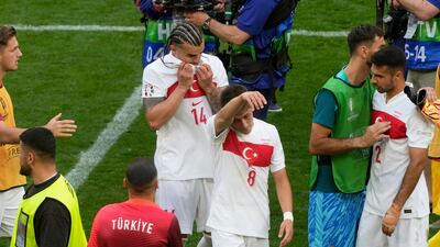 Turkey players leave the field at the end. AP